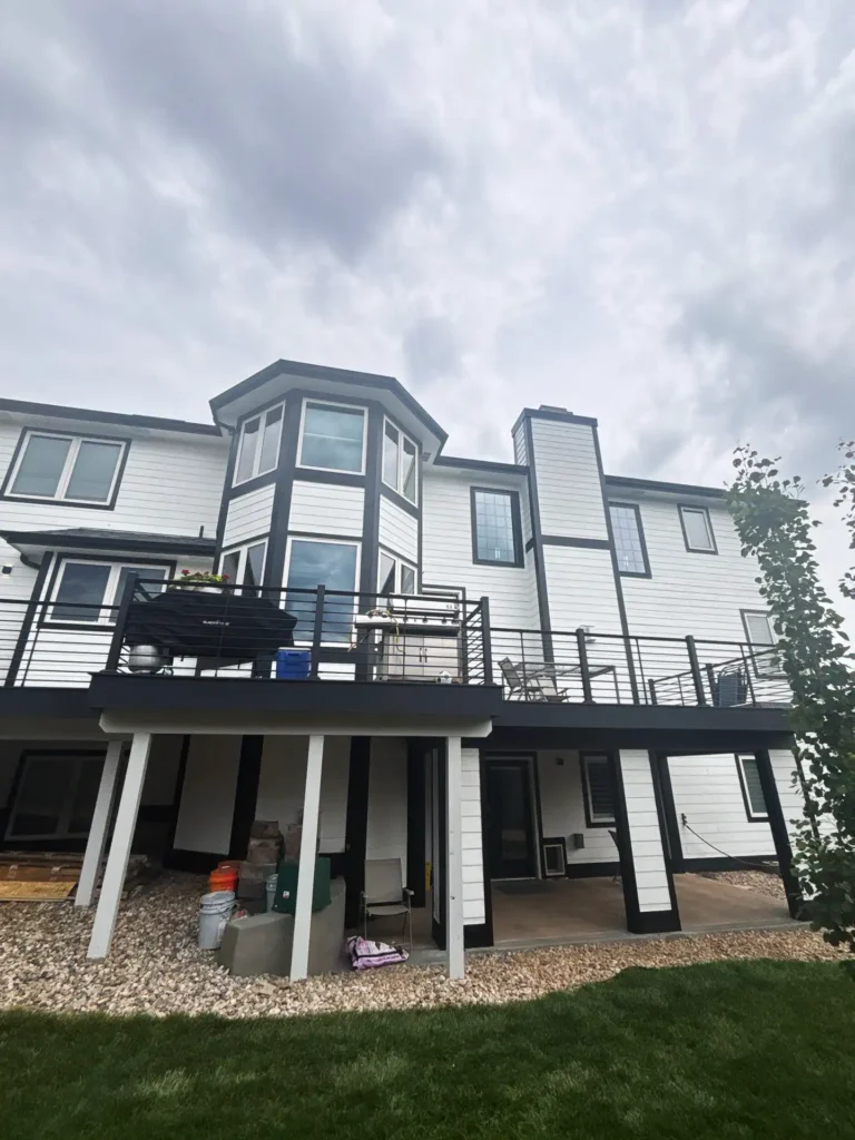 a large house with a deck and a patio