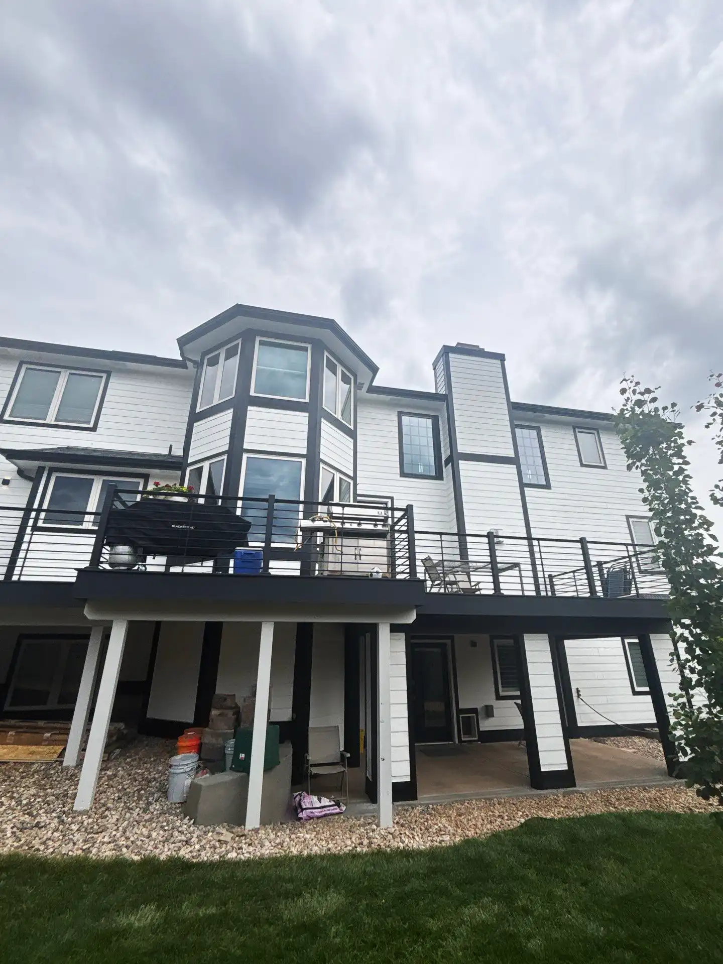 a large house with a deck and a patio